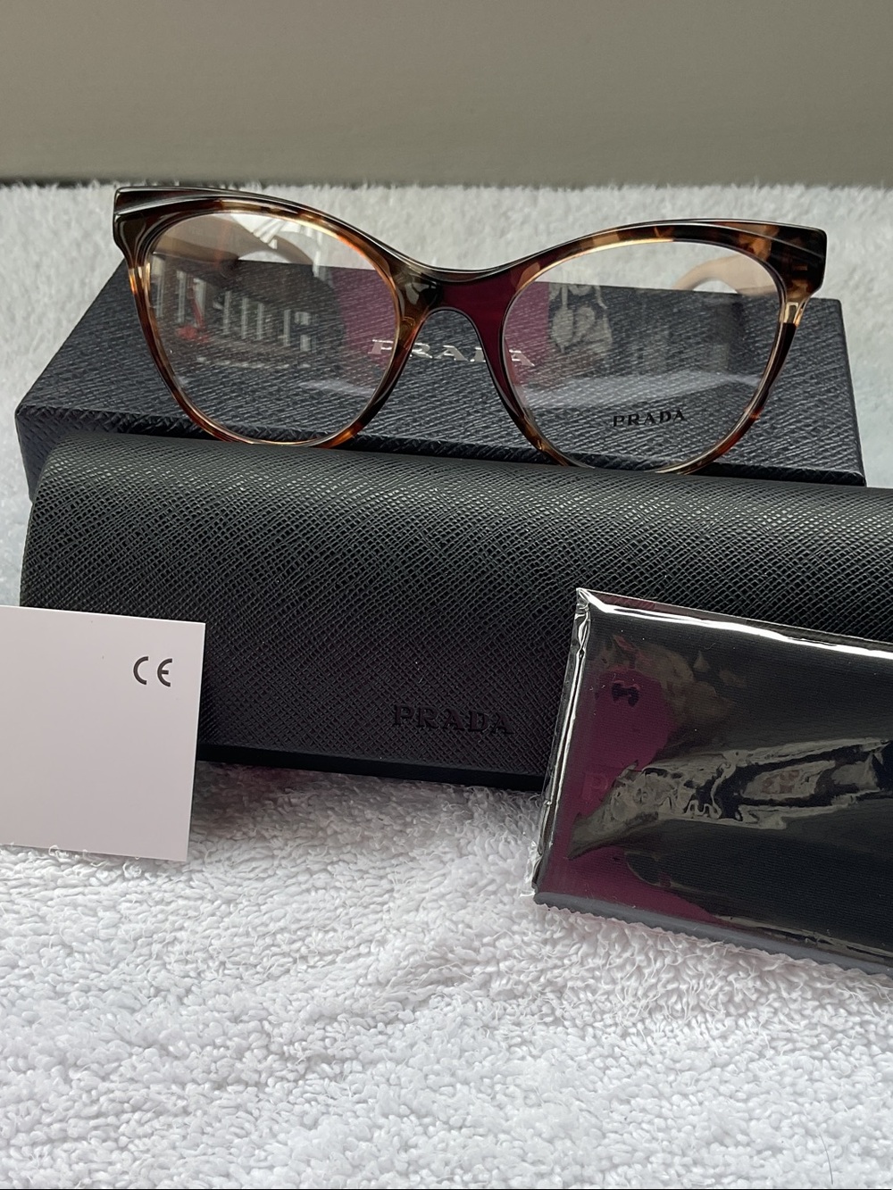 Prada Tortoiseshell Cat-Eye Optical Glasses with Subtle Amber Accents